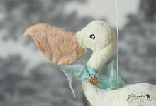 Laden Sie das Bild in den Galerie-Viewer, Pelican with Mint Ribbon Spun Cotton Figurine