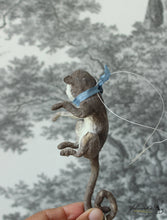 Laden Sie das Bild in den Galerie-Viewer, Sitting Monkey with Blue Ribbon Spun Cotton Figurine