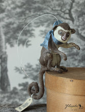 Laden Sie das Bild in den Galerie-Viewer, Sitting Monkey with Blue Ribbon Spun Cotton Figurine