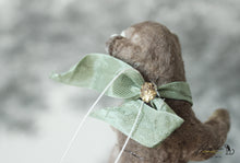 Laden Sie das Bild in den Galerie-Viewer, Sitting Monkey with Green Ribbon Spun Cotton Figurine