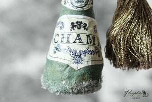 Spun Cotton Ornament Champ Bottle with Tassel and Glitter